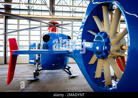 Langenhagen, Germany. 16th Jan, 2023. An Airbus EC-135 P2  police helicopter of the Lower Saxony Police Helicopter Squadron is parked on the grounds of Hannover-Langenhagen Airport. Credit: Moritz Frankenberg/dpa/Alamy Live News Stock Photo