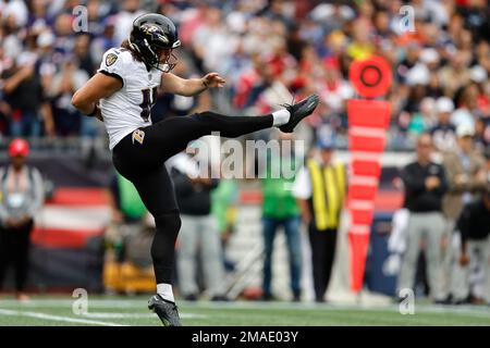 Baltimore Ravens punter Jordan Stout (11) follows through on a