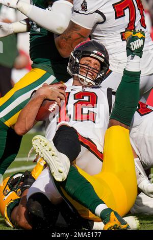 Green Bay, United States. 22nd Jan, 2022. Green Bay Packers Rashan Gary  (52) celebrates his sack on San Francisco 49ers quarterback Jimmy Garoppolo  (10) with Preston Smith (91) in the first quarter