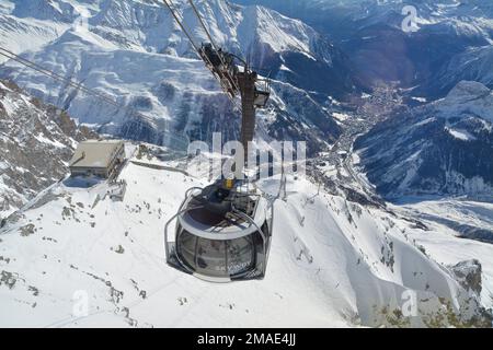 Courmayeur, Italy - February 20, 2020: Alpine cable car Skyway Monte Bianco from Courmayeur to Punta Helbronner with scenic views of Mont Blanc massif Stock Photo