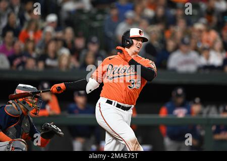 Baltimore Orioles' Adley Rutschman follows through on a swing against the  Toronto Blue Jays during the first inning of a baseball game, Tuesday, June  13, 2023, in Baltimore. (AP Photo/Julio Cortez Stock