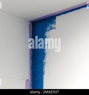 Repair. White wall in blue staining process Stock Photo