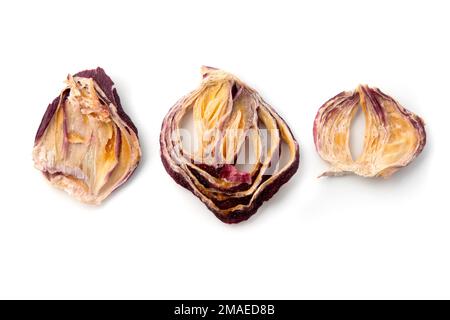 Slices of dried red onion on a white background Stock Photo