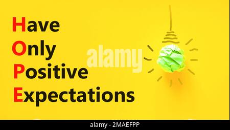 HOPE have only positive expectations symbol. Concept words HOPE have only positive expectations on yellow paper beautiful yellow background. Business Stock Photo