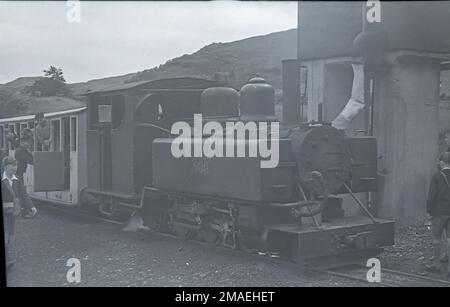 Welsh Highland Railway Baldwin 4-6-0T locomotive No.590 taking water at Portmadoc (1923) station after 1934 (it is facing Caernarvon) Stock Photo