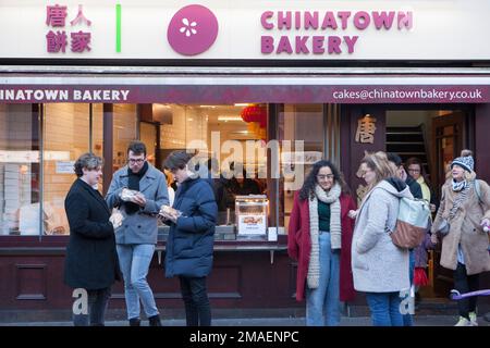 London, UK, 19 January 2023: In advance of Chinese New Year and the streets of Chinatown are packed with locals and tourists. The Chinese Year of the Rabbit begins on Sunday 22nd January and bakeries are doing brisk business in Chinese style cakes. Anna Watson/Alamy Live News Stock Photo