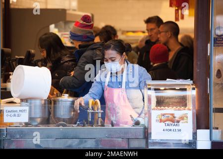 London, UK, 19 January 2023: In advance of Chinese New Year and the streets of Chinatown are packed with locals and tourists. The Chinese Year of the Rabbit begins on Sunday 22nd January and bakeries are doing brisk business in Chinese style cakes. Anna Watson/Alamy Live News Stock Photo