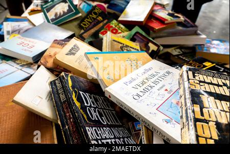 Assorted paperbacks, books chaotically thrown in a heap sold in the market in Istanbul, Turkey Stock Photo