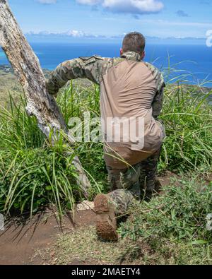 U.S. Army Staff Sgt. Jackson Fagan with the Utah Army National Guard Recruiting and Retention Battalion, finishes the mystery event at the top of Mount Lamlam during the Region VII Best Warrior Competition on the island of Guam, May 26, 2022. This annual competition featured the best noncommissioned officer and Soldier from eight different states and territories including Arizona, California, Colorado, Guam, Hawaii, Nevada, New Mexico, and Utah. Testing competitors’ skills and knowledge and pushing them to their limits, the competition graded each participant in key areas such as basic Soldier Stock Photo