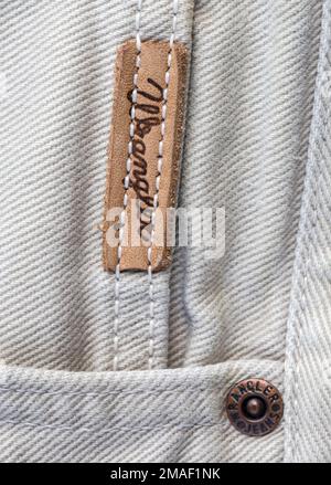 Chisinau, Moldova - August 19, 2016: Closeup of Wrangler label on white jeans. Wrangler is American manufacturer of jeans. Its headquarters is in Gree Stock Photo