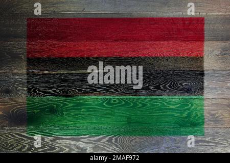 African American flag on rustic old wood surface background Stock Photo