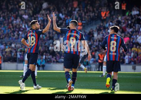 BARCELONA - DEC 31: Barcelona players celebrate after scoring a goal during the LaLiga match between FC Barcelona and RCD Espanyol at the Spotify Camp Stock Photo