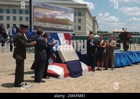 060615-N-0696M-257. [Complete] Scene Caption: The offical party (left to right) of U.S. Marine Corps GEN. Peter Pace, Chairman of the Joint Chiefs of STAFF; Mr. Jim Laychak, President of the Pentagon Memorial Fund; Ms. Rosemary Dillard, Vice President of the Pentagon Memorial Fund; the Honorable Donald H. Rumsfeld, U.S. Secretary of Defense; Ms. Julie Beckman and Mr. Keith Kaseman, Pentagon Memorial Concept designers, unveil the memorial stone during the ground-breaking ceremony at the start of the construction of the Pentagon Memorial on June 15, 2006. This memorial is being built to honor th Stock Photo