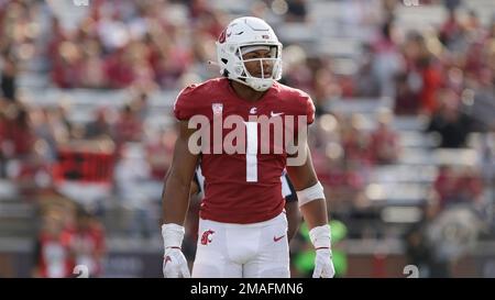 Washington State linebacker Daiyan Henley looks to the sideline