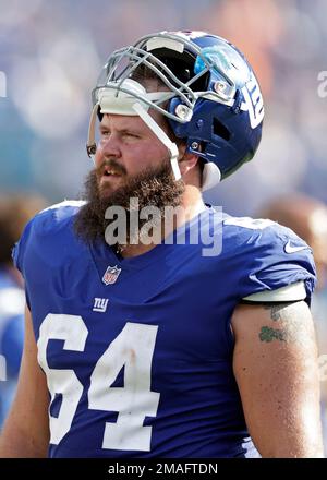 New York Giants guard Mark Glowinski (64) walks off the field after an NFL  football game against the Carolina Panthers, Sunday, Sept. 18, 2022, in  East Rutherford, N.J. (AP Photo/Adam Hunger Stock