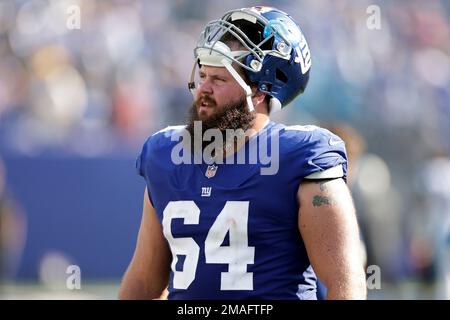 New York Giants guard Mark Glowinski (64) walks off the field