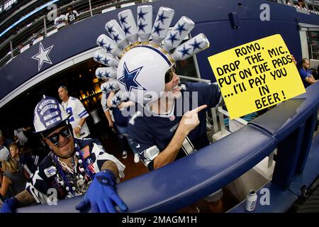 Dallas Cowboys fan, Greg Wilson, right, of Wreckin Ball Helmets