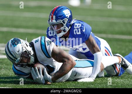 LANDOVER, MD - DECEMBER 18: New York Giants defensive back Cor'Dale Flott  (28) peeks into the backfield during the New York Giants game versus the  Washington Commanders on December 18, 2022, at