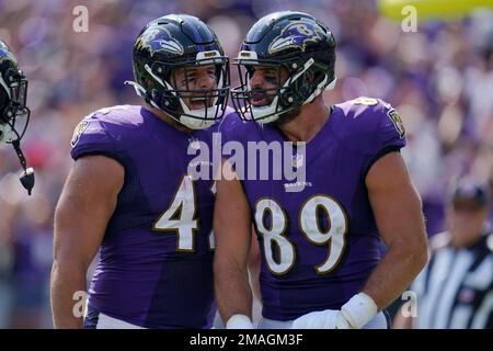 Baltimore Ravens fullback Patrick Ricard (42) runs to the right past  Pittsburgh Steelers linebacker Sean Spence (51) to score in the fourth  quarter at Heinz Field in Pittsburgh on December 10, 2017.