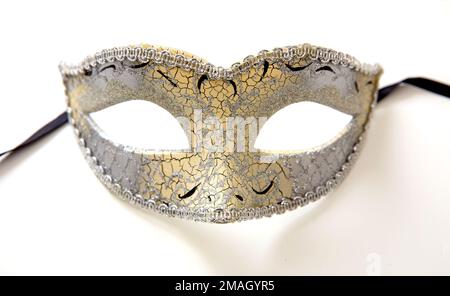 Carnival Venetian mask golden and silver glitter decoration isolated on white background Stock Photo