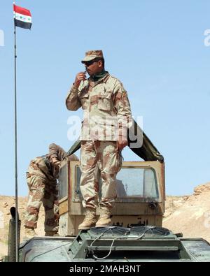 Iraqi soldiers fire the PKC machine gun during a live fire exercise of ...