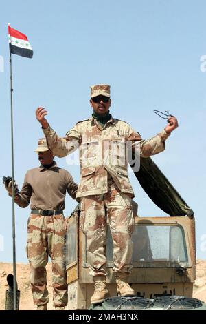 Iraqi soldiers fire the PKC machine gun during a live fire exercise of ...