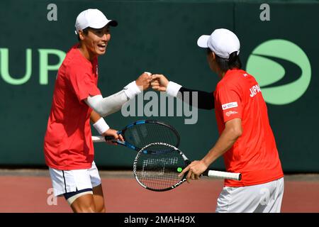 Japan's Kaito Uesugi, right, and Yusuke Watanuki celebrate a point