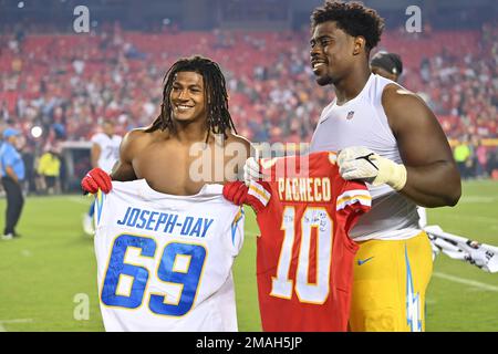 Kansas City Chiefs running back Isiah Pacheco (left) exchanges his jersey  with Los Angeles Chargers defensive tackle Sebastian Joseph-Day (right)  after an NFL football game Thursday, Sep. 15, 2022, in Kansas City