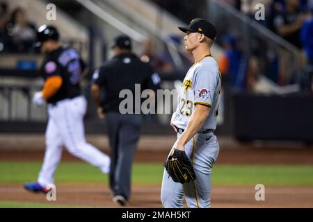 Pittsburgh Pirates' Daniel Vogelbach listens to home plate umpire