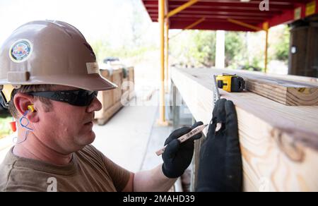 (220526-N-OI810-0828) KEY WEST, Florida (May 26, 2022) Builder 1st Class Steven Arkin, from Long Beach, Mississippi, assigned to Naval Mobile Construction Battalion (NMCB) 14, rebuilds a table at Boca Chica Air Field small arms range, Naval Air Station Key West (NASKW), May 26, 2016. Seabees assigned to NMCB-14 travelled to NASKW to perform on-site training and assist with facility and compound maintenance. NMCB-14 provides advance base construction, battle damage repair, contingency engineering, humanitarian assistance and disaster recovery support to our fleet and unified commanders. Stock Photo