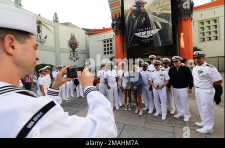 Hollywood, Calif. (May 27, 2022) – Sailors and Marines, assigned to amphibious assault ship USS Essex (LHD 2) and the San Antonio-class amphibious transport dock ship USS Portland (LPD 27), pose for a photo at the TCL Chinese Theatre during the premiere of Top Gun: Maverick as part of Los Angeles Fleet Week (LAFW) May 27, 2022. LAFW is an opportunity for the American public to meet their Navy, Marine Corps and Coast Guard teams and experience America's sea services. During fleet week, service members participate in various community service events, showcase capabilities and equipment to the co Stock Photo