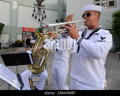 Hollywood, Calif. (May 27, 2022) – U.S. Navy Musician 3rd Class Matt Fitzsimmons, from Gaithersburg, Md., assigned to Navy Band Southwest’s Brass Quintet, plays the trumpet at the TCL Chinese Theatre during the premiere of Top Gun: Maverick as part of Los Angeles Fleet Week (LAFW) May 27, 2022. LAFW is an opportunity for the American public to meet their Navy, Marine Corps and Coast Guard teams and experience America's sea services. During fleet week, service members participate in various community service events, showcase capabilities and equipment to the community, and enjoy the hospitality Stock Photo