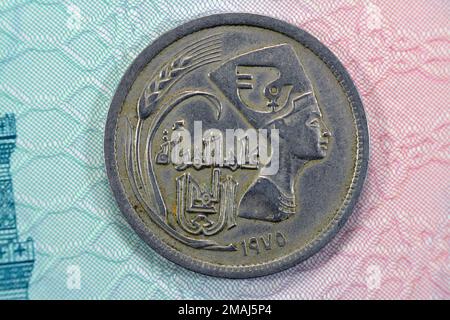 Old Egyptian Arab Republic of Egypt 5 five piasters coin with the bust of queen Nefertiti on obverse side commemorative of year of the woman, date and Stock Photo