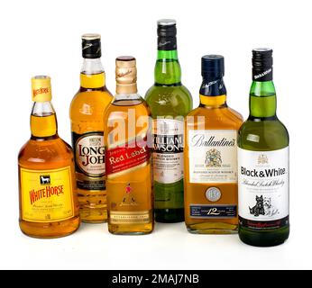 CHISINAU, MOLDOVA - January 27, 2016: Several types of bottled alcohol White Horse,Long John, Johny Walker, William Wilsons, Ballantines, Black&White. Stock Photo