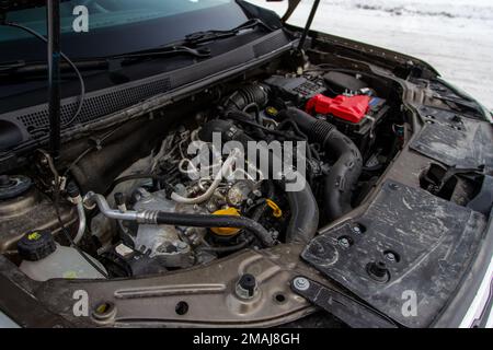 MOSCOW, RUSSIA - JANUARY 09, 2022 Renault Duster (Second generation) engine. SUV car with open hood. Car engine and parts under hood bonnet Stock Photo