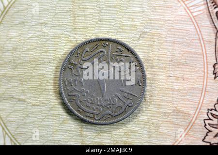 Round old Egyptian coin of two 2 milliemes series 1929 AD 1348 AH features king Fuad I of Egypt on obverse side and value with date on the reverse sid Stock Photo