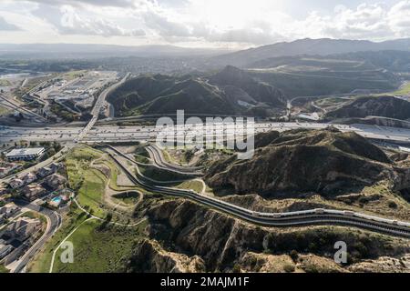 Aerial view of the Interstate 5 freeway and Los Angeles aqueduct cascades near Mission Hills and Newhall in Southern California. Stock Photo