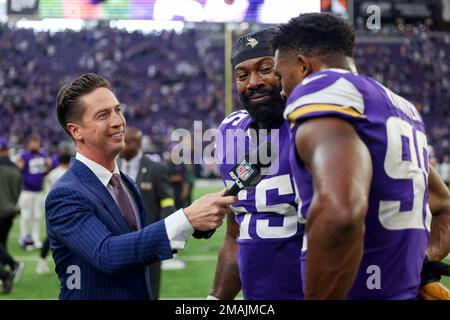 NFL Network reporter Tom Pelissero, left, interviews Minnesota