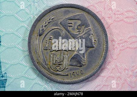 Old Egyptian Arab Republic of Egypt 5 five piasters coin with the bust of queen Nefertiti on obverse side commemorative of year of the woman, date and Stock Photo