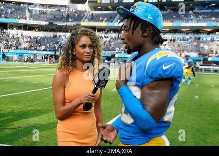 NFL Network reporter Kayla Burton, left, interviews Dallas Cowboys