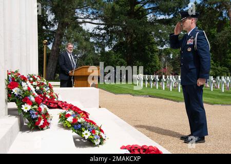 U.S. Air Force Brig. Gen. Jefferson J. O'Donnell, U.S. European Command senior defense official and defense attaché, salutes during a Memorial Day ceremony at the Brookwood American Military Cemetery, England, May 29, 2022. Memorial Day provides us a solemn opportunity to remember our fallen brothers and sisters in arms, reflect upon their courageous sacrifice, and show gratitude for the freedom they gave their lives to defend. It also affords us the opportunity to pay homage to those families who lost their loved ones in service to the Nation-and continue to feel the full weight of that sacri Stock Photo