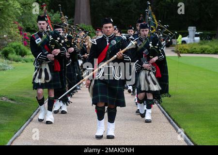 Students from Gordon’s School Pipes and Drums in West End, Surrey, provide musical support during a Memorial Day ceremony at the Brookwood American Military Cemetery, England, May 29, 2022. Memorial Day provides us a solemn opportunity to remember our fallen brothers and sisters in arms, reflect upon their courageous sacrifice, and show gratitude for the freedom they gave their lives to defend. It also affords us the opportunity to pay homage to those families who lost their loved ones in service to the Nation-and continue to feel the full weight of that sacrifice today. Stock Photo