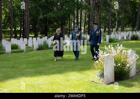 U.S. Air Force Brig. Gen. Jefferson J. O'Donnell, right, U.S. European Command senior defense official and defense attaché, Brig. Gen. Paul Doyle, Commander and Defence Advisor at the High Commission of Canada, and guest, walk through the Brookwood American Military Cemetery, England, after a Memorial Day ceremony May 29, 2022. Memorial Day provides us a solemn opportunity to remember our fallen brothers and sisters in arms, reflect upon their courageous sacrifice, and show gratitude for the freedom they gave their lives to defend. It also affords us the opportunity to pay homage to those fami Stock Photo