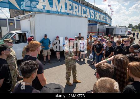 Brigadier General Brandon R. Tegtmeier speaks words of encouragement to new U.S. Army recruits during a NASCAR race May 29, 2022, at Charlotte Motor Speedway, North Carolina. The race took place on Memorial day in honor of those who have defended the nation's freedoms by paying the ultimate sacrifice. Stock Photo