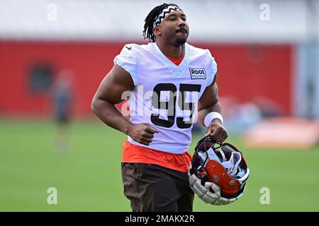 FILE - In this Aug. 8, 2019, file photo, Cleveland Browns defensive end  Chris Smith (50) sits on the sideline during the first half of an NFL  preseason football game against the