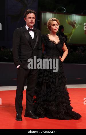 Caylee Cowan, left, and Casey Affleck arrive at the amfAR Gala Los