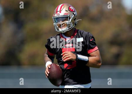 FILE - San Francisco 49ers quarterback Steve Young upends Dallas