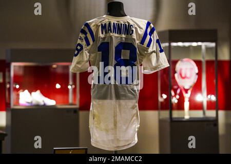 NFL quarterback Peyton Manning's 2003 Indianapolis Colts game jersey, from his final game in his first MVP season, is displayed as part of Sotheby's sports memorabilia auction dubbed 'Invictus,' Tuesday Sept. 6, 2022, in New York. The sale, open through Thursday, Sept. 15, features a variety of athletes who have had deep and lasting impact on their respective sports. (AP Photo/Bebeto Matthews)