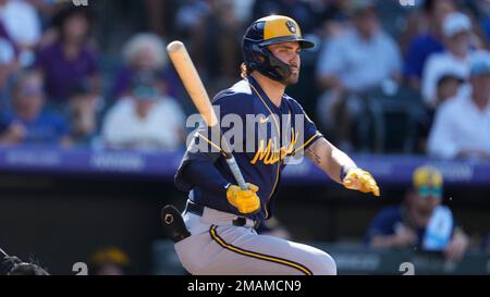 Milwaukee Brewers center fielder Garrett Mitchell leaves the game with a  shoulder injury, accompanied by head athletic trainer Scott Barringer,  center, and manager Craig Counsell, right, during a baseball game against  the