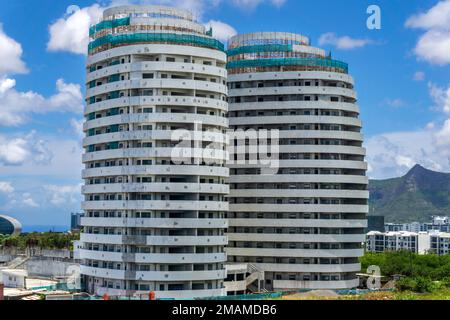 Mauritius, December 2021 - Unusual tall cylindrical buildings under construction Stock Photo